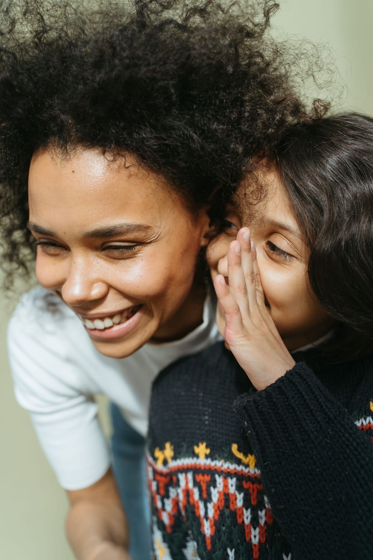 Mother and child laughing together