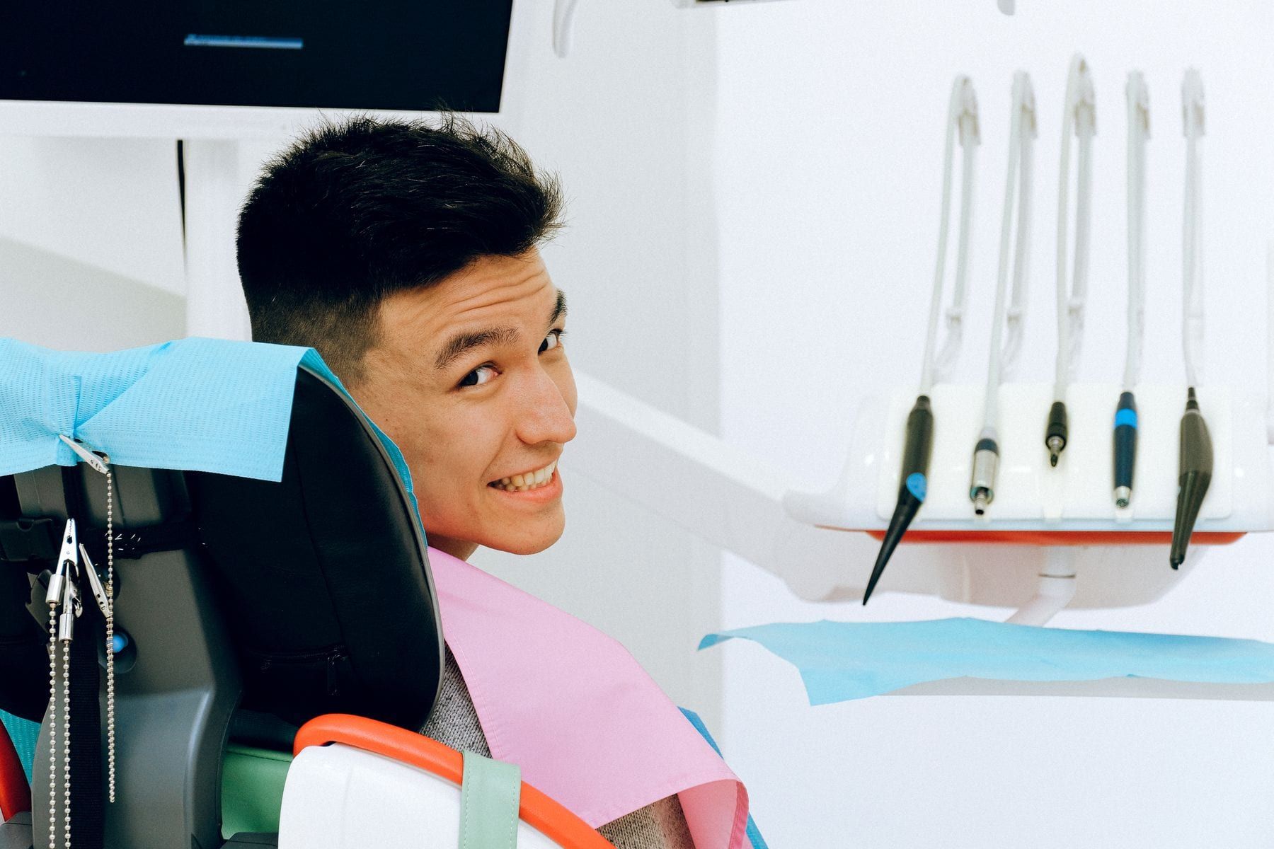Relaxed patient smiling in the dental chair